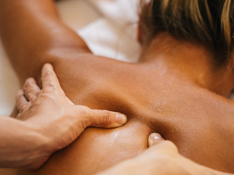 Deep tissue massage on a client’s back at Stillwater Wellness, Commerce City CO