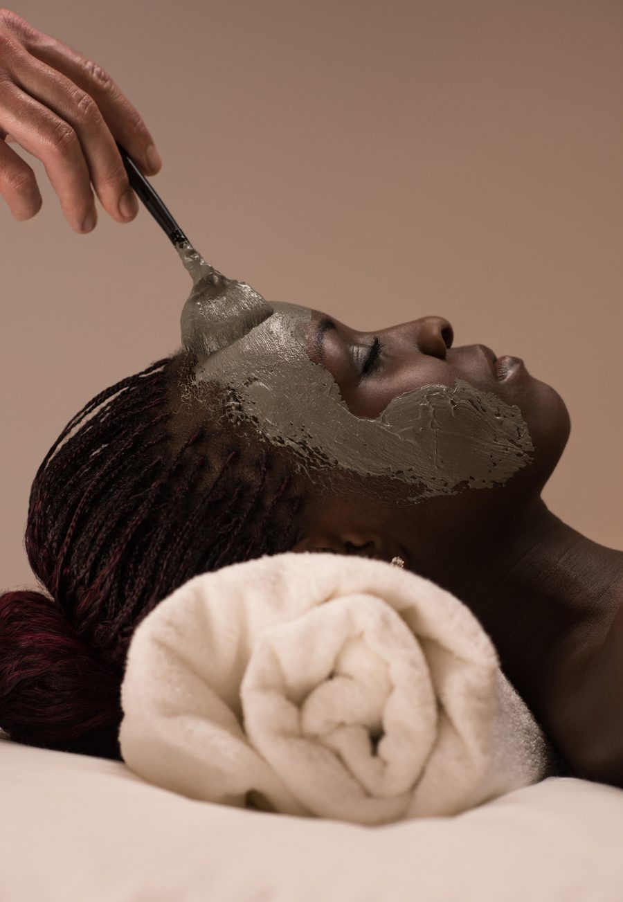 Client enjoying a clay mask facial at Stillwater Wellness, Commerce City CO