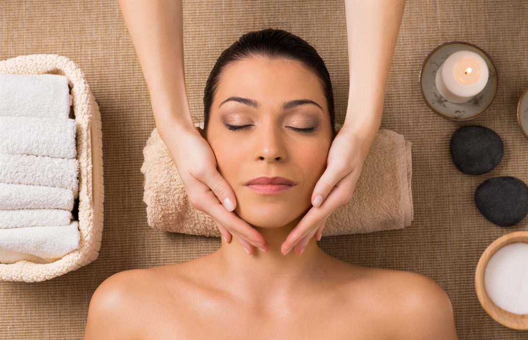 Client relaxing during a facial aesthetics treatment at Stillwater Wellness