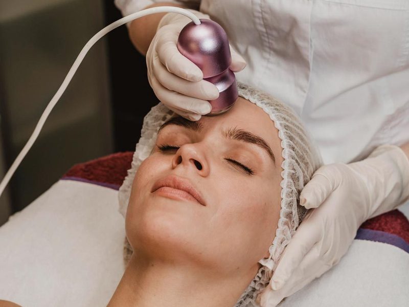 Microchanneling device gliding across a client’s cheek